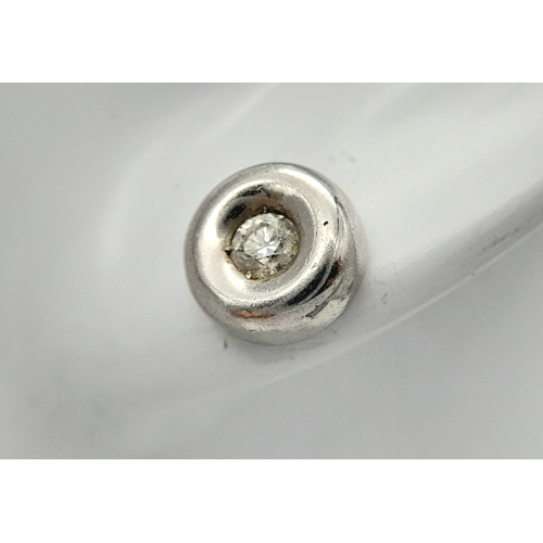 548 - A PAIR OF 18K WHITE GOLD RUB-OVER SET DIAMOND STUD EARRINGS. 0.30CTW. 2.1G. A/S 1312.