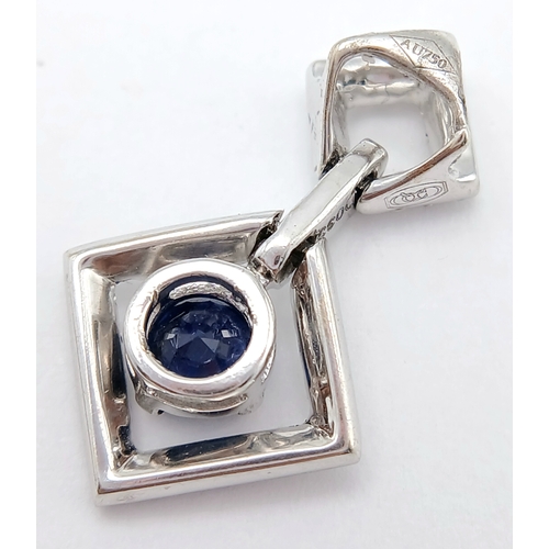 555 - AN 18K WHITE GOLD DIAMOND AND SAPPHIRE DROP PENDANT. 0.33CTW DIAMONDS AND 0.60CT SAPPHIRE. 2.5G.
22M... 