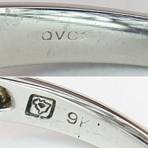 558 - An Impressive 9 Carat White Gold Tanzanite and Diamond Set Ring, Size O. The Ring is set with sixtee... 