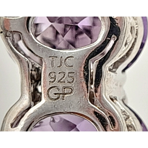 565 - A Pretty Sterling Silver Amethyst, Pink Tourmaline and Garnet Bracelet. One Size Pull Through Adjust... 