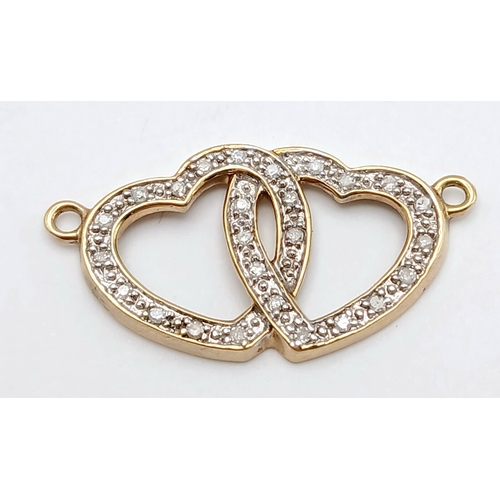 566 - A 14K YELLOW GOLD DIAMOND SET DOUBLE HEART PENDANT, JUST REQUIRES A CHAIN. TOTAL WEIGHT 1.4G. SC 903... 