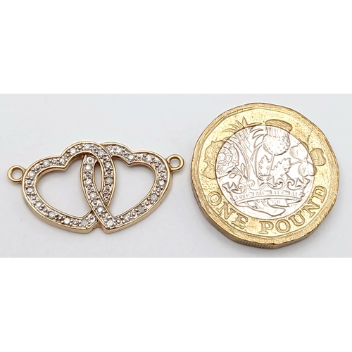 566 - A 14K YELLOW GOLD DIAMOND SET DOUBLE HEART PENDANT, JUST REQUIRES A CHAIN. TOTAL WEIGHT 1.4G. SC 903... 