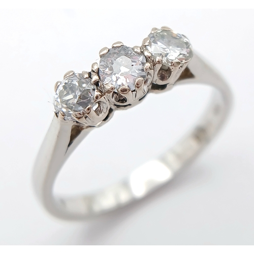 569 - A PLATINUM DIAMOND 3 STONE RING. 0.70CTW. 3.5G. SIZE L. A/S -1313.