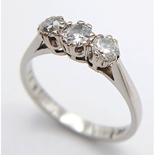 569 - A PLATINUM DIAMOND 3 STONE RING. 0.70CTW. 3.5G. SIZE L. A/S -1313.