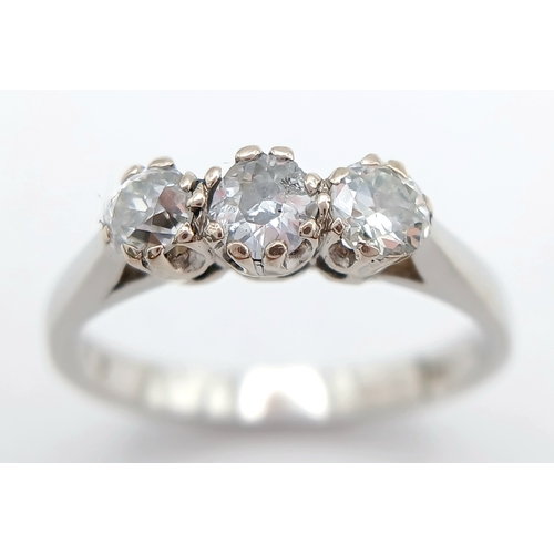 569 - A PLATINUM DIAMOND 3 STONE RING. 0.70CTW. 3.5G. SIZE L. A/S -1313.