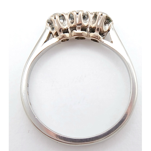 569 - A PLATINUM DIAMOND 3 STONE RING. 0.70CTW. 3.5G. SIZE L. A/S -1313.