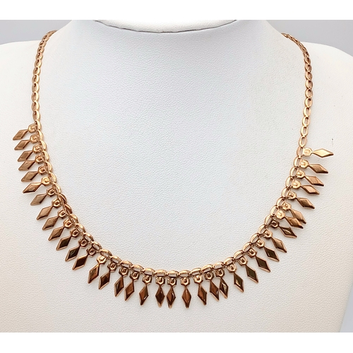 570 - A 9K Yellow Gold Diamond Head Form Necklace. 42cm. 6.9g. Note: Clasp in need of a new spring.