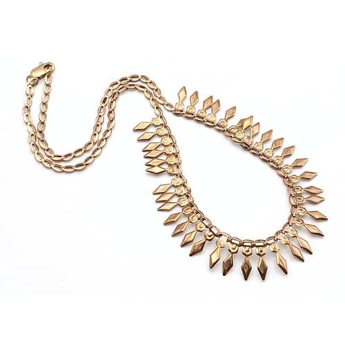 570 - A 9K Yellow Gold Diamond Head Form Necklace. 42cm. 6.9g. Note: Clasp in need of a new spring.