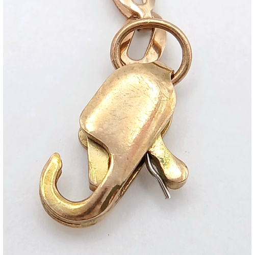 570 - A 9K Yellow Gold Diamond Head Form Necklace. 42cm. 6.9g. Note: Clasp in need of a new spring.