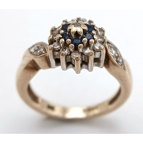 587 - A 9K YELLOW GOLD DIAMOND AND SAPPHIRE RING. TOTAL WEIGHT 2.8G, SIZE F. SC 9064