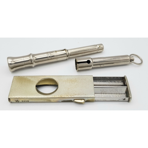 595 - 2 x Vintage CIGARETTE CUTTERS to include a SOLINGEN together with a rare CONCINUMM ‘CLARINET’  CIGAR... 