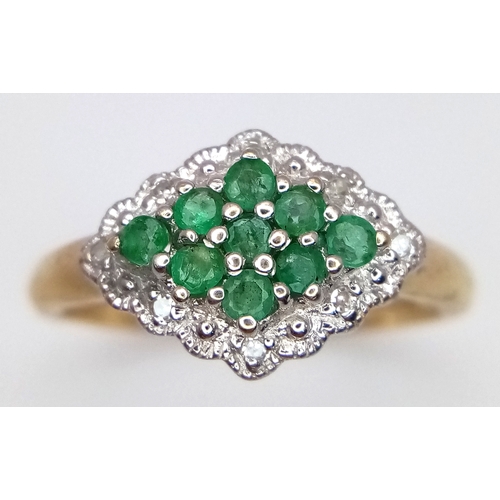 600 - A 9K YELLOW GOLD DIAMOND AND EMERALD RING. TOTAL WEIGHT 2.7G. SIZE P. SC 9084