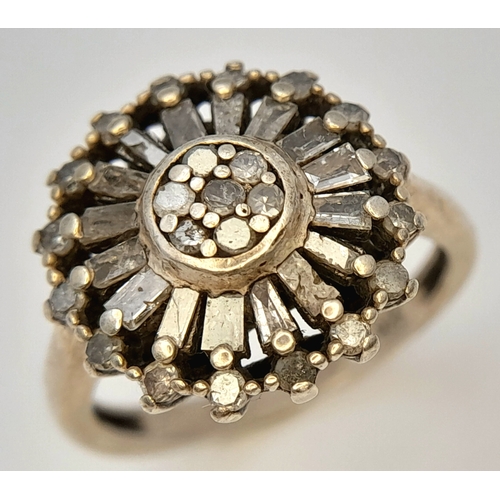 613 - A Vintage Sterling Silver Art Deco Design Diamond Cluster Ring, Size L. The ring is set with a profu... 