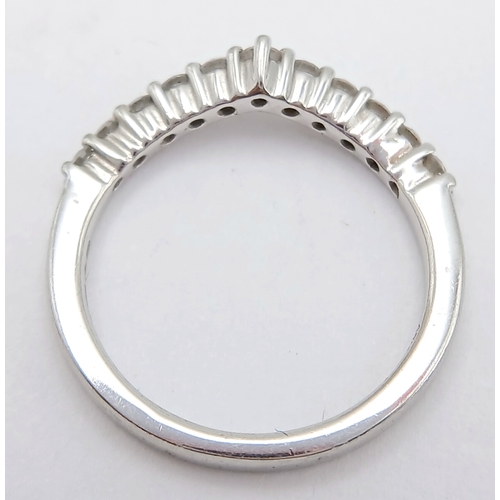 614 - A PLATINUM DIAMOND SET SHAPED BAND RING, 0.26CT DIAMOND WEIGHT. TOTAL WEIGHT 2.8G. SIZE H. 8252