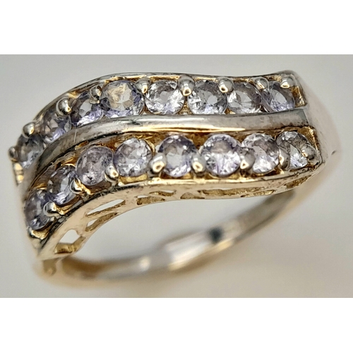 641 - A Sterling Silver Two Row Wave Style Tanzanite Ring, Size N1/2. The Ring is set with Sixteen 2mm Rou... 