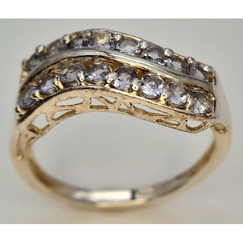 641 - A Sterling Silver Two Row Wave Style Tanzanite Ring, Size N1/2. The Ring is set with Sixteen 2mm Rou... 