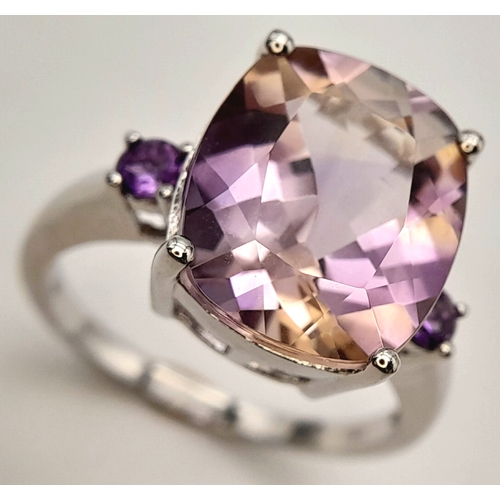 725 - A Pretty Sterling Silver Ametrine and Amethyst Set Trilogy Ring, Size S. The ring is set with a 1.5c... 