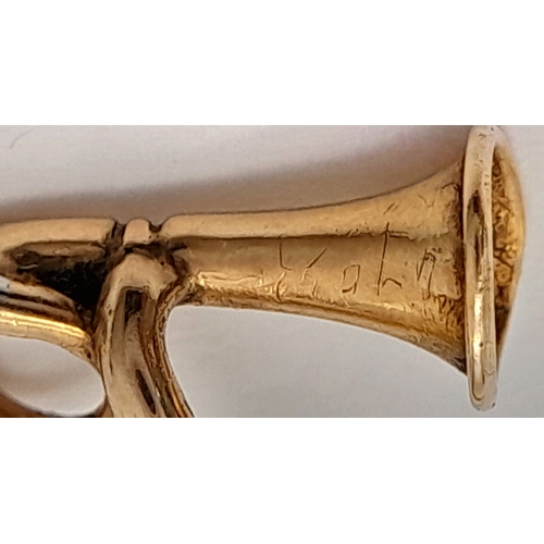 728 - Antique Yellow Metal Stick Pin with GOLD BUGLE. 1.45 Grams. 6.0 cm.