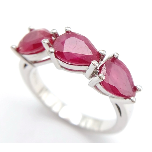 739 - A Sterling Silver Pear Cut Ruby Set Trilogy Ring, Size Q, The Ring is set with three 8mm Length Rubi... 