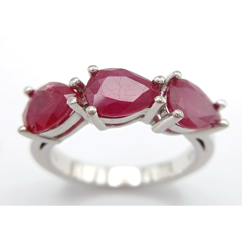 739 - A Sterling Silver Pear Cut Ruby Set Trilogy Ring, Size Q, The Ring is set with three 8mm Length Rubi... 