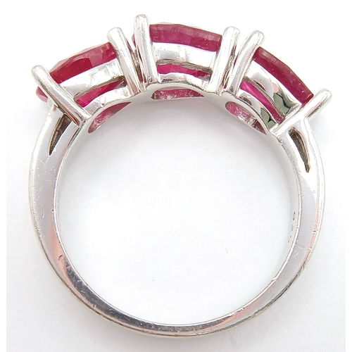 739 - A Sterling Silver Pear Cut Ruby Set Trilogy Ring, Size Q, The Ring is set with three 8mm Length Rubi... 