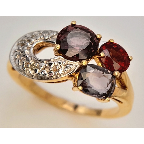 746 - An Impressive Gold on Sterling Silver, Garnet Amethyst, Tourmaline and Diamond Set Ring, Size S. The... 
