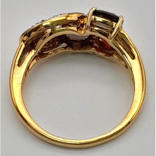 746 - An Impressive Gold on Sterling Silver, Garnet Amethyst, Tourmaline and Diamond Set Ring, Size S. The... 