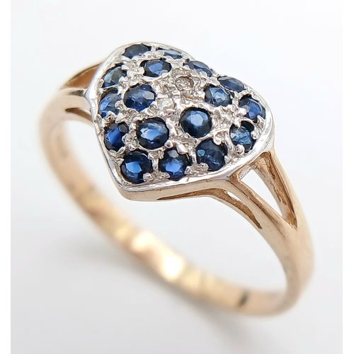 747 - A 9K YELLOW GOLD DIAMOND AND SAPPHIRE SET HEART CLUSTER RING. TOTAL WEIGHT 1.6G. SIZE N. SC 9065
