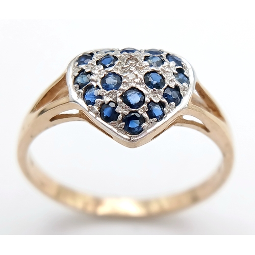 747 - A 9K YELLOW GOLD DIAMOND AND SAPPHIRE SET HEART CLUSTER RING. TOTAL WEIGHT 1.6G. SIZE N. SC 9065