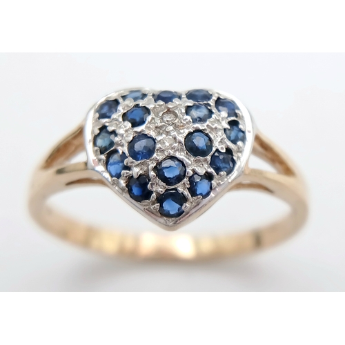 747 - A 9K YELLOW GOLD DIAMOND AND SAPPHIRE SET HEART CLUSTER RING. TOTAL WEIGHT 1.6G. SIZE N. SC 9065