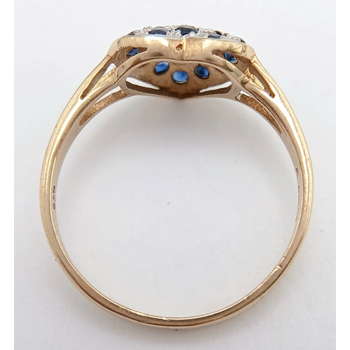 747 - A 9K YELLOW GOLD DIAMOND AND SAPPHIRE SET HEART CLUSTER RING. TOTAL WEIGHT 1.6G. SIZE N. SC 9065