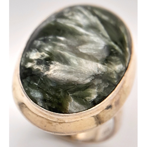 760 - An Early 21 st Century Sterling Silver and Seraphinite Cabochon Ring, Size N. Seraphinite is reputed... 