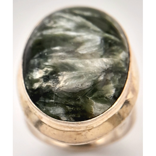 760 - An Early 21 st Century Sterling Silver and Seraphinite Cabochon Ring, Size N. Seraphinite is reputed... 