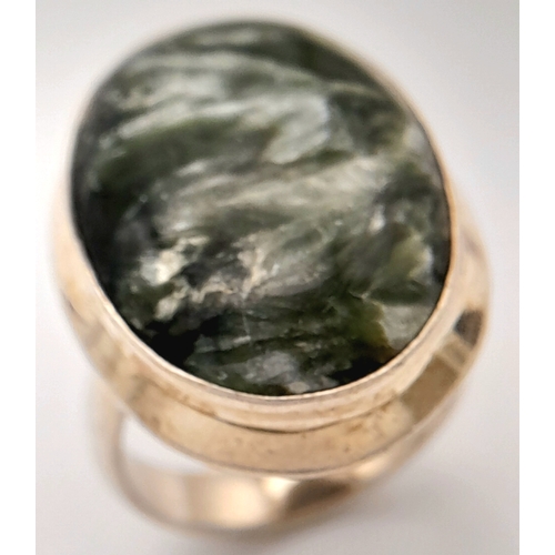 760 - An Early 21 st Century Sterling Silver and Seraphinite Cabochon Ring, Size N. Seraphinite is reputed... 