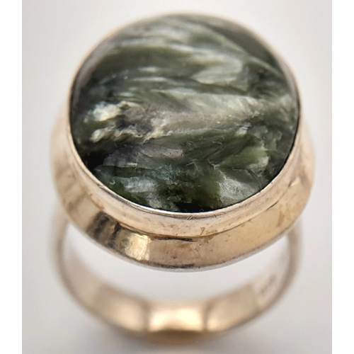 760 - An Early 21 st Century Sterling Silver and Seraphinite Cabochon Ring, Size N. Seraphinite is reputed... 