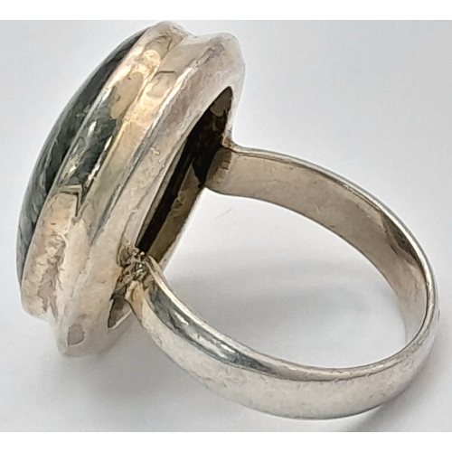 760 - An Early 21 st Century Sterling Silver and Seraphinite Cabochon Ring, Size N. Seraphinite is reputed... 