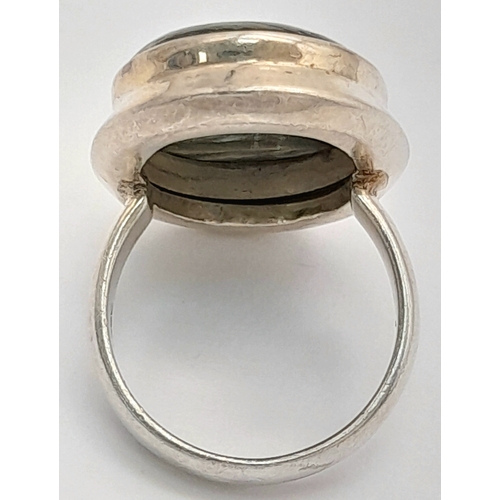 760 - An Early 21 st Century Sterling Silver and Seraphinite Cabochon Ring, Size N. Seraphinite is reputed... 