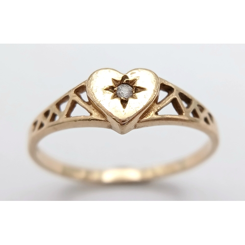 761 - A 9K YELLOW GOLD DIAMOND SET HEART RING. TOTAL WEIGHT 1.2G, SIZE M. SC 9069