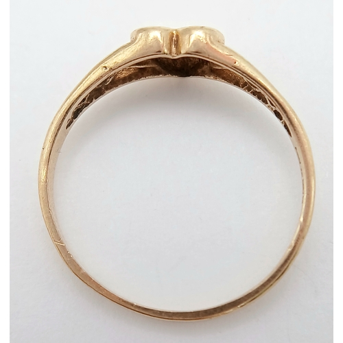 761 - A 9K YELLOW GOLD DIAMOND SET HEART RING. TOTAL WEIGHT 1.2G, SIZE M. SC 9069