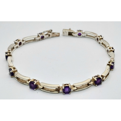 767 - A Very Elegant Sterling Silver Amethyst Set Tennis Bracelet-19cm Length. The Bracelet is set with El... 