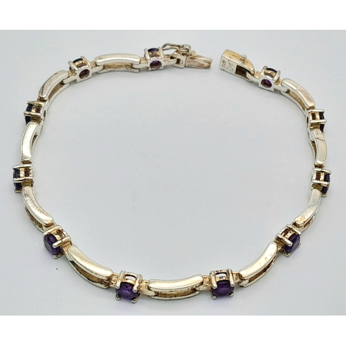 767 - A Very Elegant Sterling Silver Amethyst Set Tennis Bracelet-19cm Length. The Bracelet is set with El... 