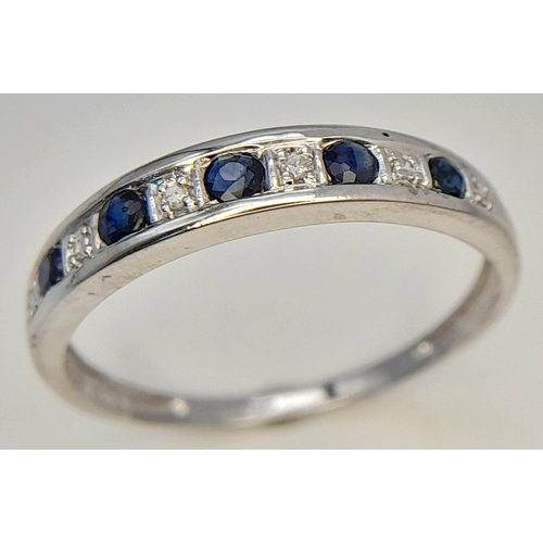 768 - A 9K WHITE GOLD DIAMOND AND SAPPHIRE RING. TOTAL WEIGHT 1.4G. SIZE O. SC 9080