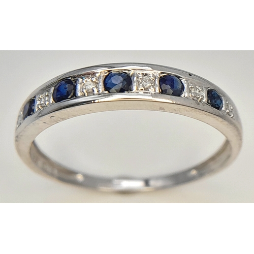 768 - A 9K WHITE GOLD DIAMOND AND SAPPHIRE RING. TOTAL WEIGHT 1.4G. SIZE O. SC 9080
