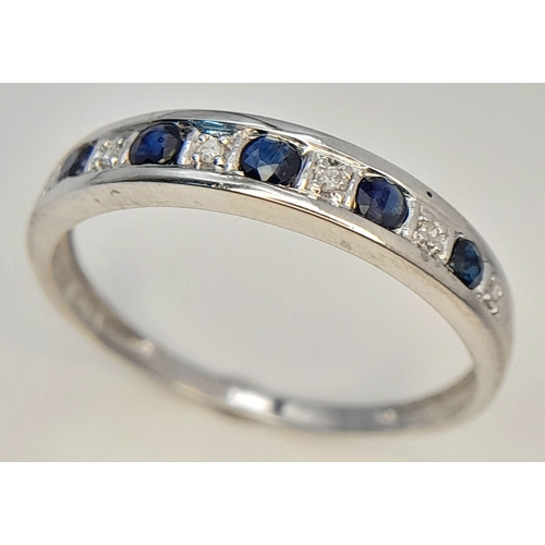768 - A 9K WHITE GOLD DIAMOND AND SAPPHIRE RING. TOTAL WEIGHT 1.4G. SIZE O. SC 9080