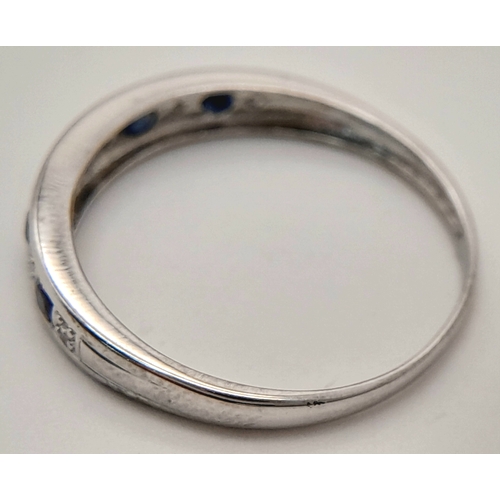 768 - A 9K WHITE GOLD DIAMOND AND SAPPHIRE RING. TOTAL WEIGHT 1.4G. SIZE O. SC 9080