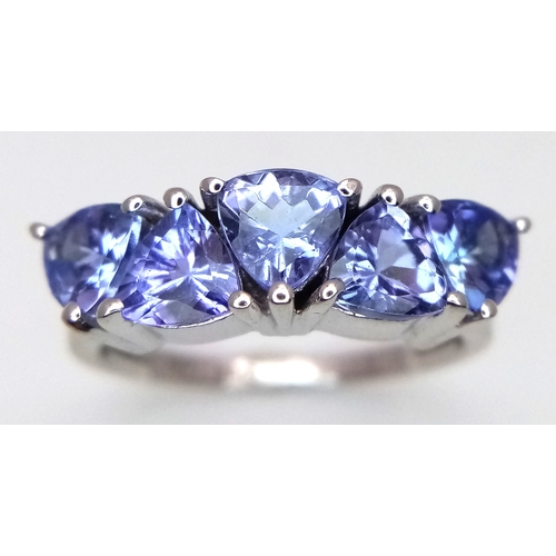 774 - A Sterling Silver and Trillion Cut Tanzanite Ring, Size O. The Ring is set with Five 5mm Long Trilli... 
