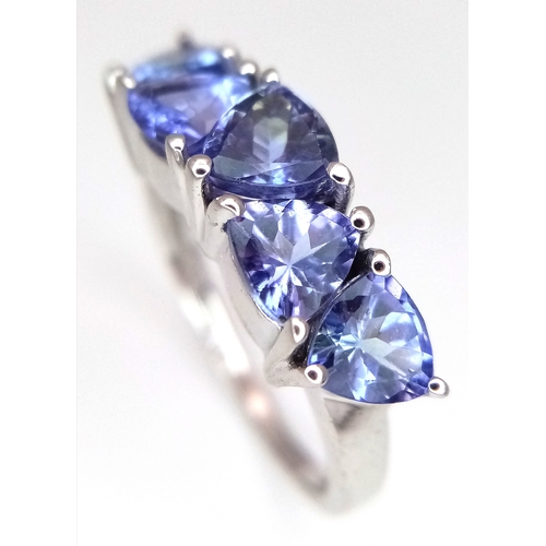 774 - A Sterling Silver and Trillion Cut Tanzanite Ring, Size O. The Ring is set with Five 5mm Long Trilli... 