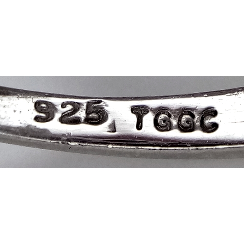 774 - A Sterling Silver and Trillion Cut Tanzanite Ring, Size O. The Ring is set with Five 5mm Long Trilli... 