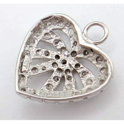 782 - A 9K WHITE GOLD DIAMOND SET HEART PENDANT / CHARM. TOTAL WEIGHT 1.4G. 333I