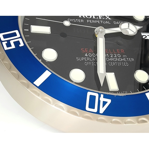 840 - A ROLEX DEALERS CONCESSIONARY WALL CLOCK POWERED BY ONE AA BATTERY. 34cm DIAMETER.